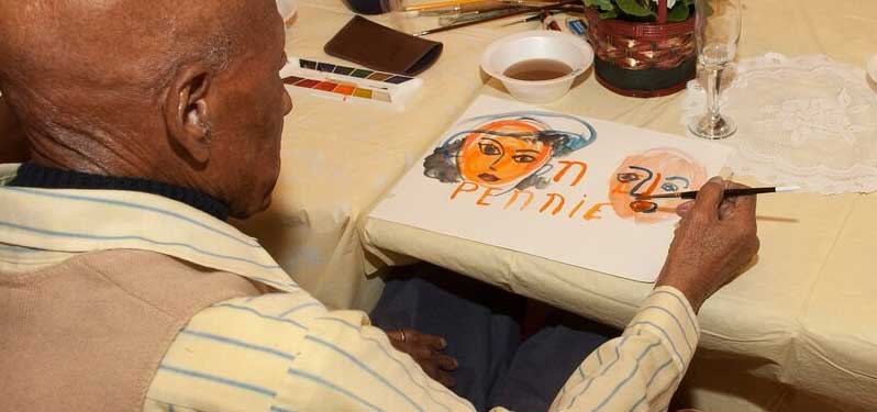 Program participants enjoy creative activities such as painting, shown here.